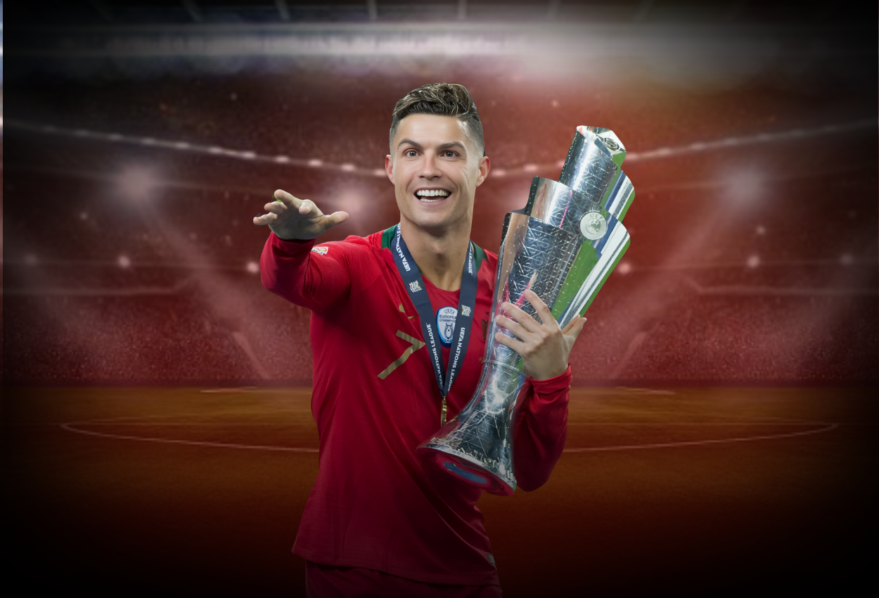 Ronaldo holding a trophy in celebration, wearing a red jersey with a stadium background illuminated by bright lights.