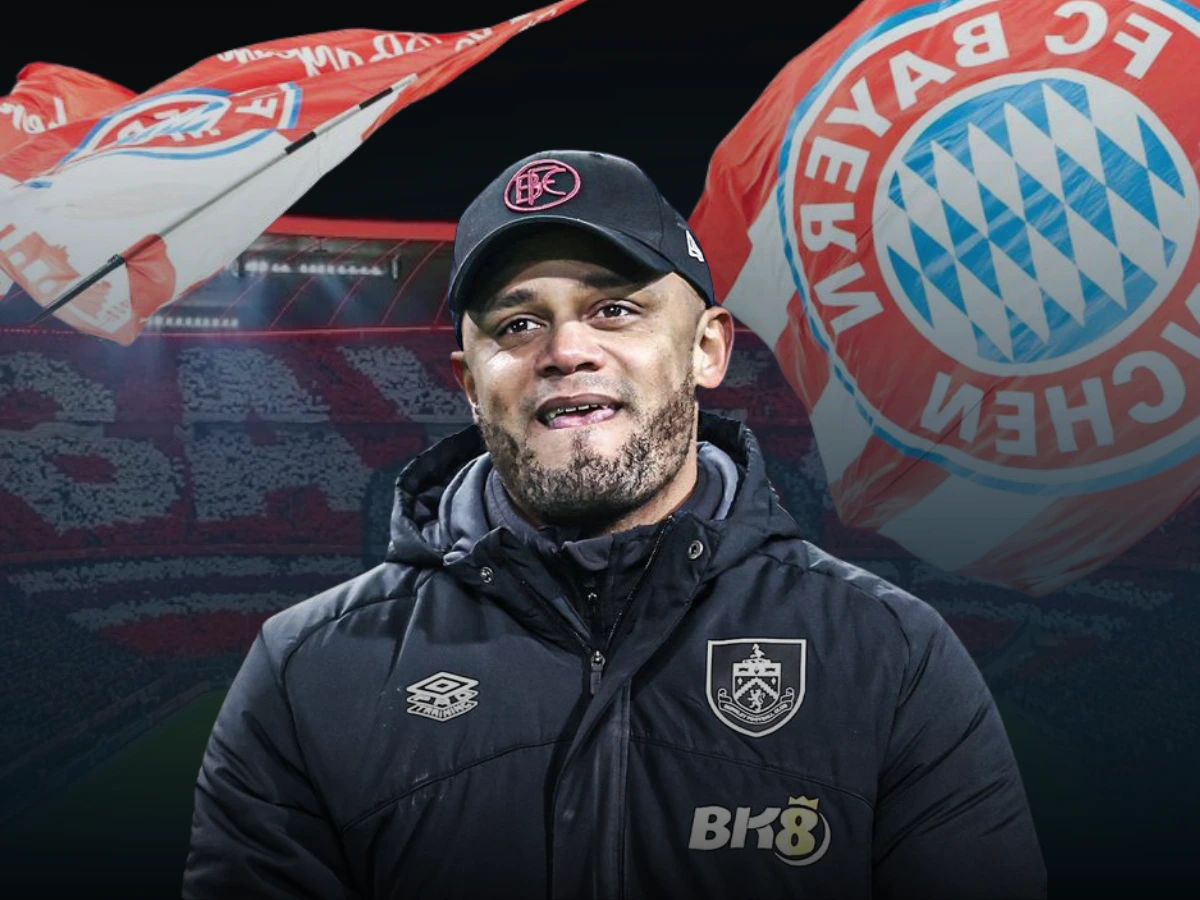 Vincent Kompany with Bayern Munich flags behind