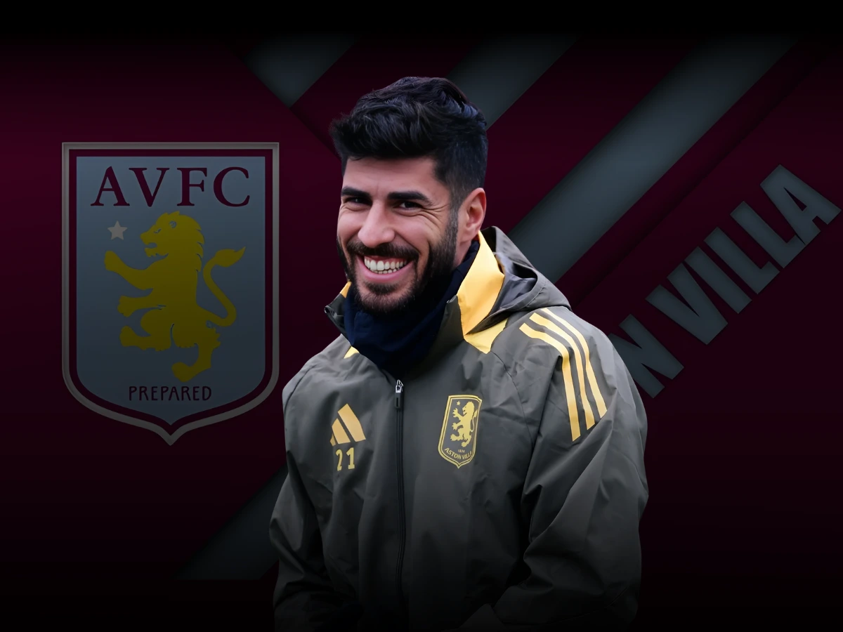 Aston Villa's Marco Asensio smiles in training gear, with the club's emblem in the background.