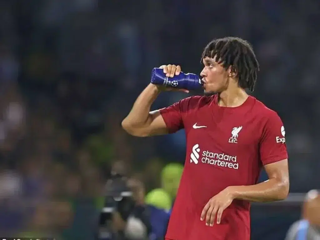 Trent Alexander-Arnold drinking water during a Champions League match.
