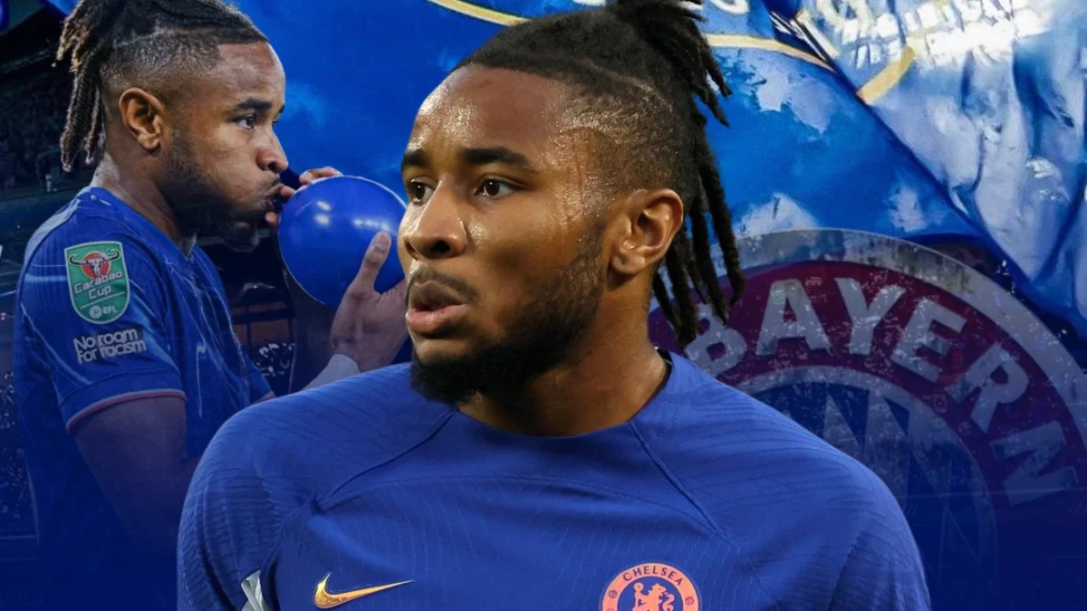 A graphic featuring Christopher Nkunku in a Chelsea FC jersey with a blue background. Nkunku appears in the foreground with a focused expression, and a secondary image of him blowing up a blue balloon is in the background. The design includes elements of the Chelsea and Bayern Munich logos