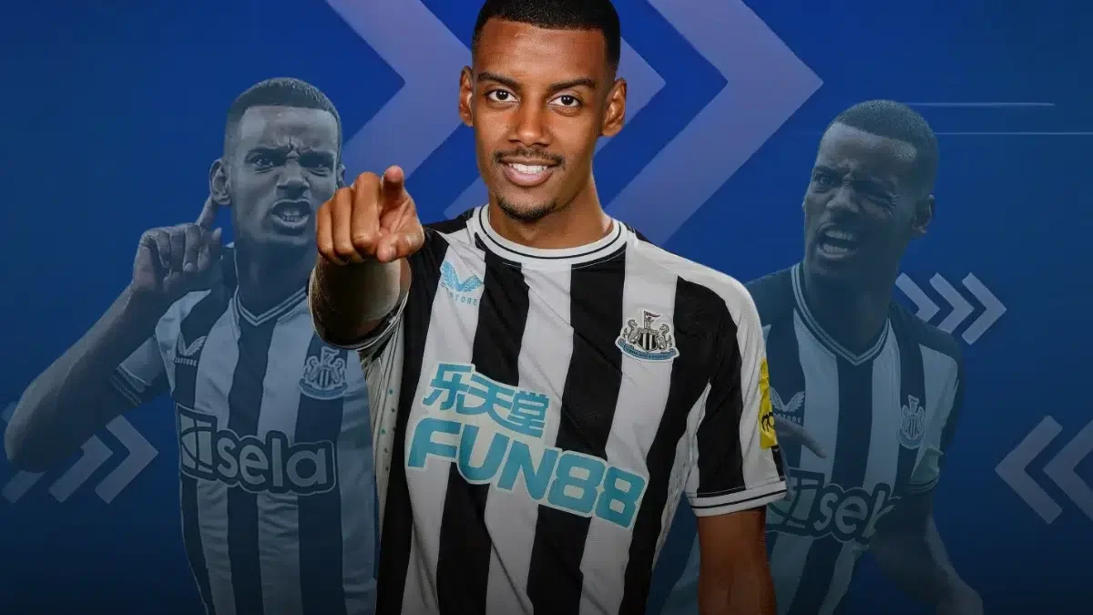 Alexander Isak, a Newcastle United player, wearing the club's black-and-white striped jersey, pointing towards the camera with a confident expression. Two faded images of him celebrating are in the background against a blue design.